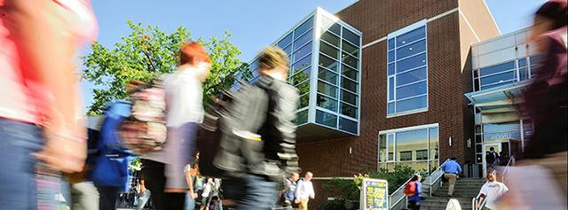 Students enter a building to learn about The University of Akron admissions process.